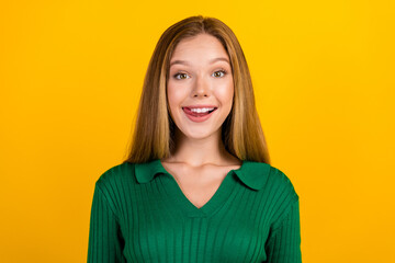 Photo of positive adorable person beaming smile tongue lick teeth isolated on yellow color background