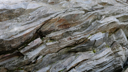 Rock wall in nature from North Carolina as aged texture background.