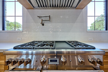 Kitchen Stove Top and Vent Hood in Modern Home
