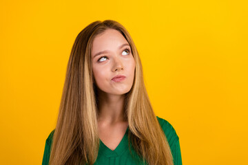 Photo of pensive minded person look empty space brainstorming decide isolated on yellow color...
