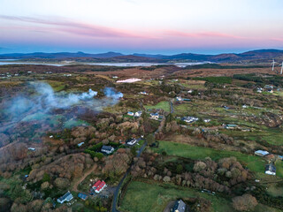 Smoke over Lough Fad due to traditionally burning of waste in rural Ireland - County Donegal