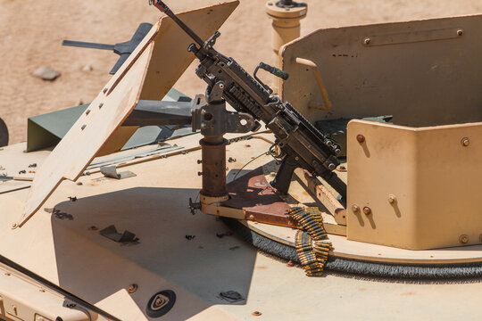 Machine gun mounted on Humvee and person shooting the .50 Caliber. 
