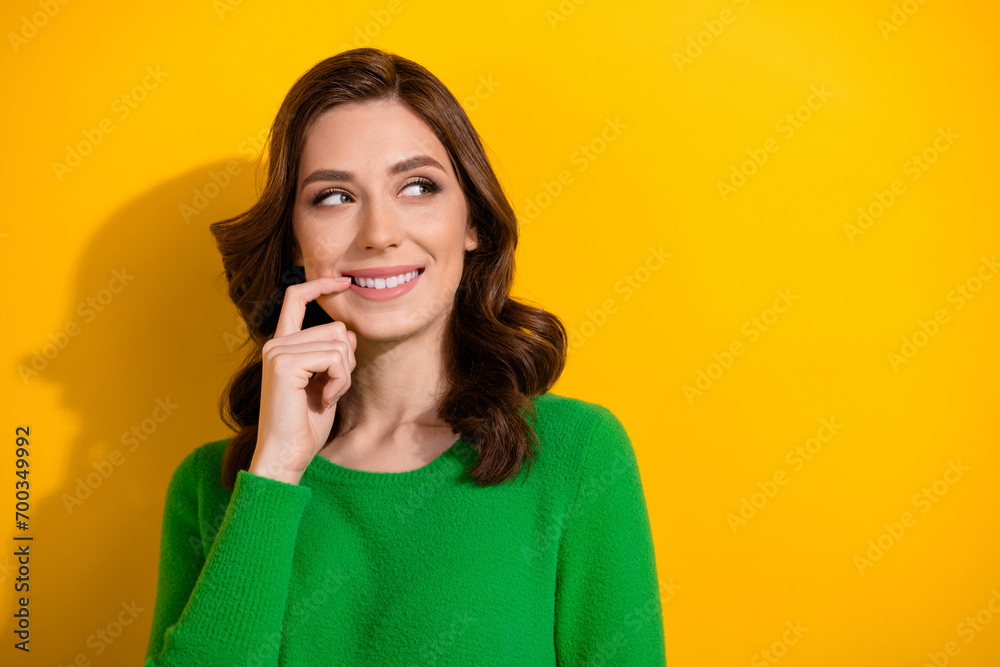 Sticker Photo of minded lovely cute girl hand touch face look interesting offer news hmm empty space isolated on yellow color background