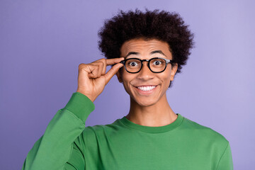 Photo of funky excited man dressed green sweater arm spectacles smiling isolated violet color background