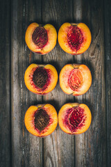 Ripe peaches on a wooden table