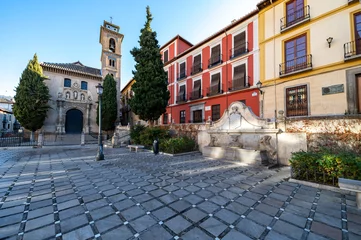 Foto op Canvas Granada, Spain  December-25, 2023: View of Plaza Nueva with the church of Santa Ana and the Pilar del Toro fountain, at the entrance to the Albaicin neighborhood in Granada (Spain) © Miguel Ángel RM