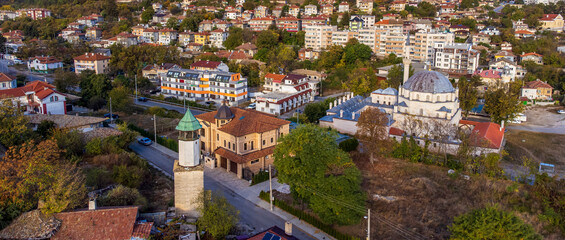 The clock tower built during the Ottoman period in Shumen, Bulgaria and Sherif Halil Pasha Mosque - Tombul Camii