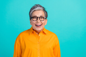 Photo portrait of laughing crazy pensioner grandmother in good mood have fun wearing orange shirt...