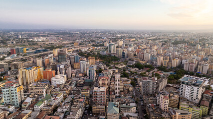 Fototapeta na wymiar Cityscape of Dar es Salaam at sunset featuring residential and office buildings.