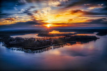 Sunrise beautiful sky over lake and waterfront vacation homes and boat houses on Tims Ford Lake in...