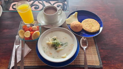 Continental breakfast. Hotel breakfast. Egg and milk broth with arepa and chocolate. Breakfast on the table.