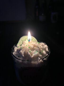Decorative candles. Scented candles. Themed candles. Burning candle in the dark. Lemon candle.