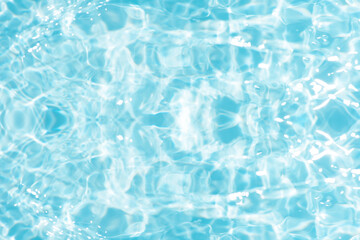 Bluewater waves on the surface ripples blurred. Defocus blurred transparent blue colored clear calm water surface texture with splash and bubbles. Water waves with shining pattern texture background.