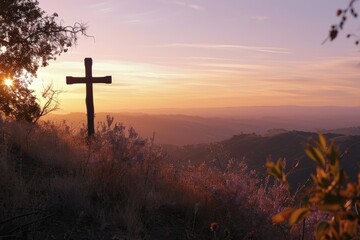 A cross on a hill bathed in the lavender and gold of twilight, a scene of peace and reflection as the day transitions to night. - obrazy, fototapety, plakaty