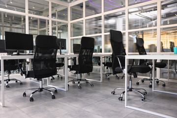 Comfortable office chairs and tables in meeting room