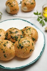 Traditional Ukrainian bread (Pampushky) with garlic on light table