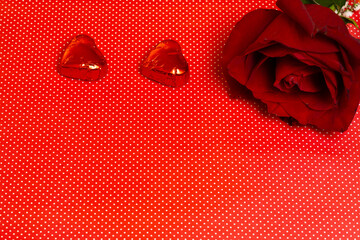valentines day rose and chocolates on a polka dot background