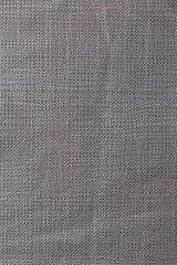 Fototapeta na wymiar close-up of gray non-woven fabric material surface, abstract of washable, durable and made directly from fibers that are bonded together, background texture in full frame