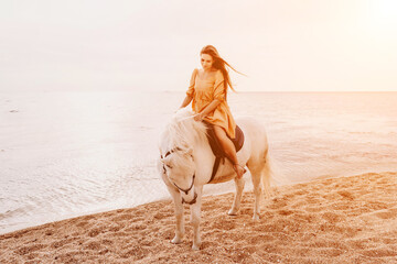A woman in a dress stands next to a white horse on a beach, with the blue sky and sea in the background.