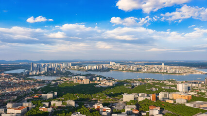 Naklejka premium Green city, green roof, ecological city, urban planning, blue sky and white clouds