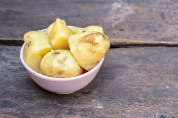 Boiled Potato in White Bowl Isolated on Wooden Background with Copy Space