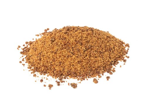 Granulated Sugarcane Jaggery or Indian Gur Isolated on White Background with Copy Space