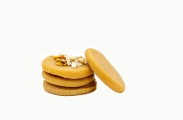 Peda or Pera Sweets Garnished with Almond Nut, Pistachio and Cashew Isolated on White Background with Copy Space