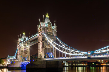 Fototapeta na wymiar Tower Bridge is a Grade I listed combined bascule and suspension bridge in London,