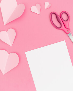 Valentine's Day Pink Hearts Pink Background with White Paper for Copy
