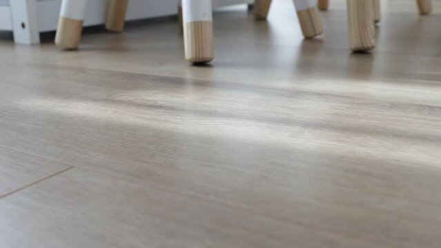 New laminate flooring. Laminated parquet with brown wooden texture