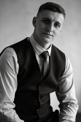 portrait of a cheerful groom in a blue suit