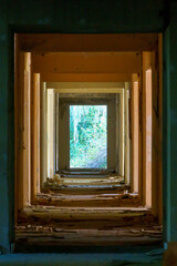 Renovation in the apartment. Destroyed buildings after an earthquake or cataclysm. Walls without plaster and broken red brick. Lack of windows and doors in abandoned apartments.