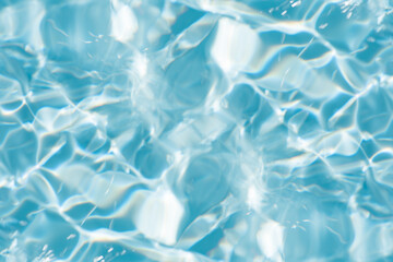Bluewater waves on the surface ripples blurred. Defocus blurred transparent blue colored clear calm water surface texture with splash and bubbles. Water waves with shining pattern texture background. - obrazy, fototapety, plakaty