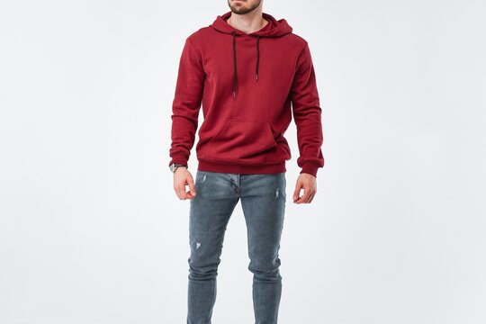 Bearded man wearing a red hoodie in a studio. A blank template mock-up for printing designs on the sweatshirt. The front and back views of the merchandise apparel.