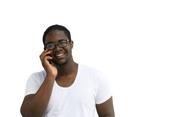A man in a white T-shirt on a White background talks on the phone