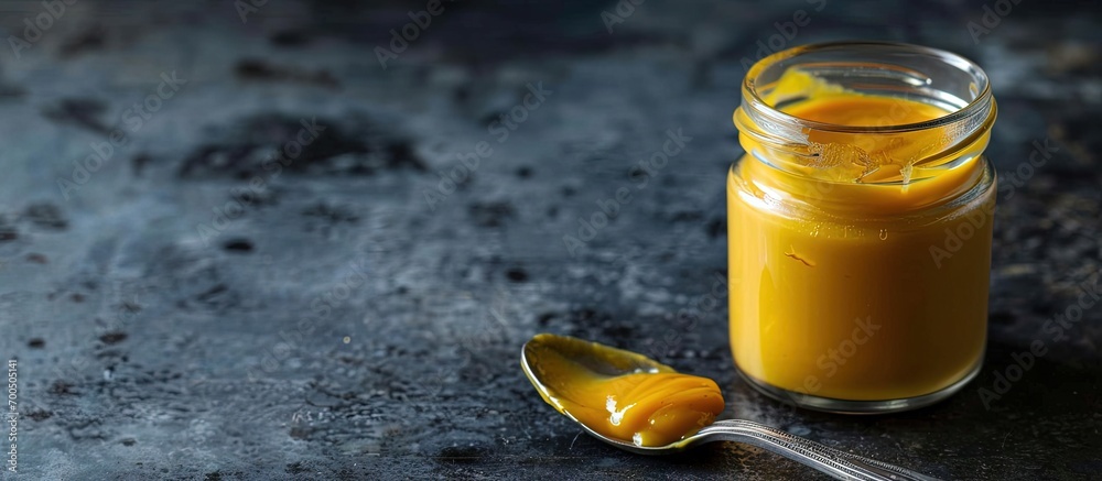 Poster homemade honey mustard salad dressing in a jar. creative banner. copyspace image