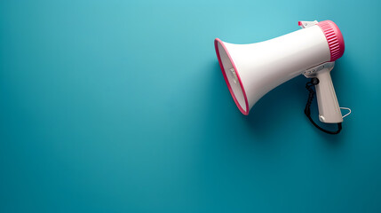 Megaphone or hand speaker isolated on blue background with copy space