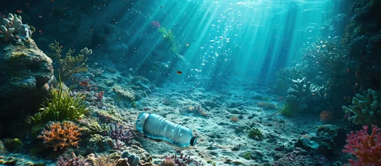 Fotobehang A very old non biodegradable plastic bottle on the sea floor on a tropical coral reef. Creative Banner. Copyspace image © HN Works
