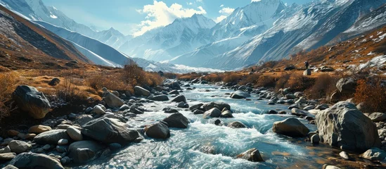 Fototapete Manaslu Himalaya mountains and stream water from melted glacier view from Bimthang village in Manaslu circuit trekking route in Nepal Asia. Creative Banner. Copyspace image