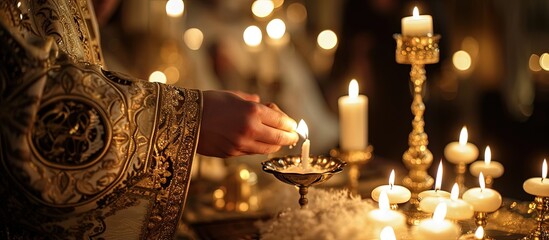 Christening ceremony in the Orthodox church priest lighting candles at children baptismal font close up. Creative Banner. Copyspace image - obrazy, fototapety, plakaty