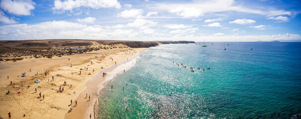 Panoramic view of Playa de Mujeres. Popular beach in Lanzarote on Playa Blanca, Canary Islands,...