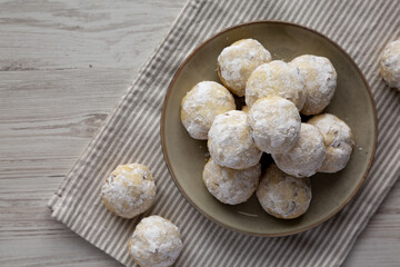 Homemade Snowball Cookies on a Plate, top view. Flat lay, overhead, from above.