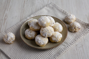 Homemade Snowball Cookies on a Plate, side view.