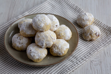 Homemade Snowball Cookies on a Plate, side view.