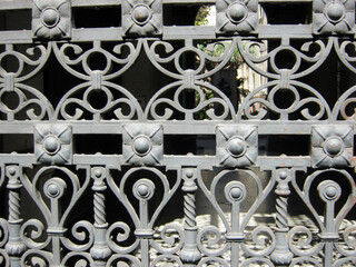 beautiful gray cast iron grate with floral patterns