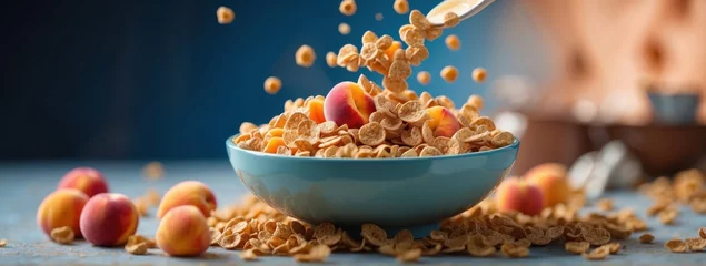 Tuinposter Vibrant, dynamic image of the exact moment milk and cereal spill into a bowl filled with crunchy cereal and fresh fruits. The blue background highlights the bright colors of the ingredients © sebas
