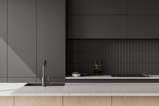 Stylish home kitchen interior with counter, sink and kitchenware with shelves