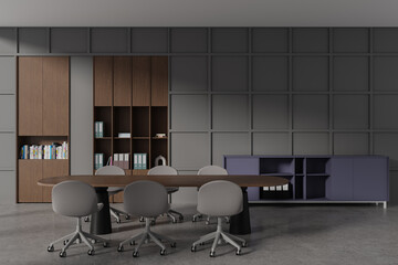 Grey office interior with meeting table and seats, sideboard with documents