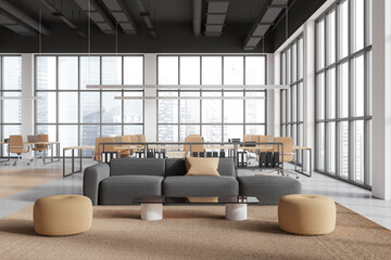 Modern office interior lounge and coworking zone near panoramic window