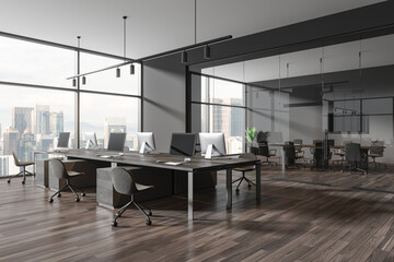 Grey business interior with workplace and conference room, panoramic window